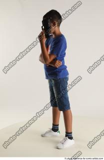 TIMBO STANDING POSE WITH GUN